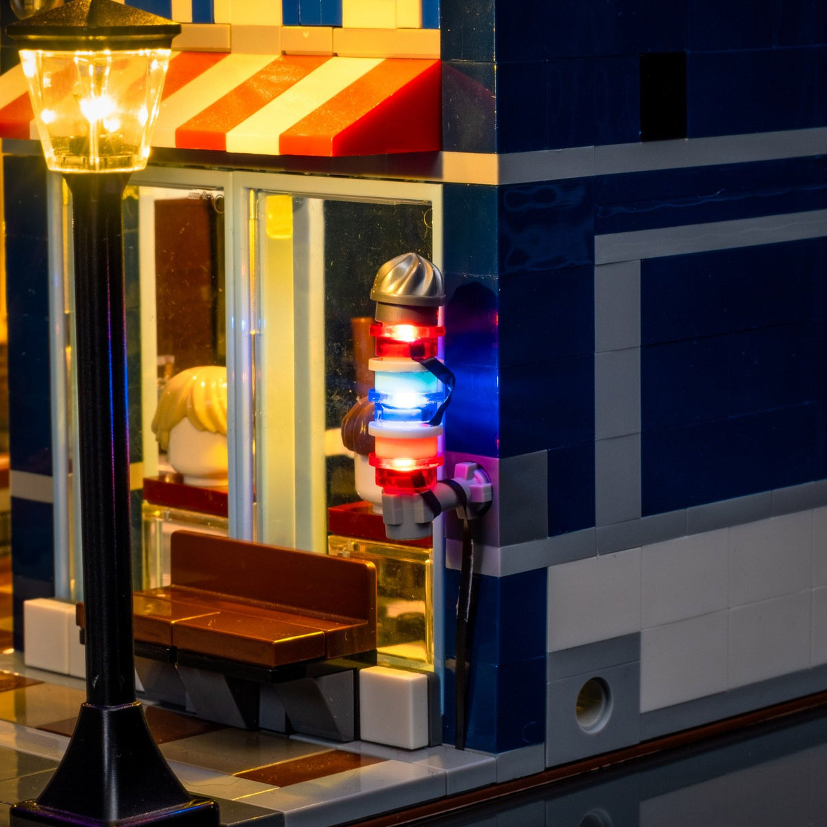 Red white and blue illuminated barber’s pole on the LEGO® Detective’s Office