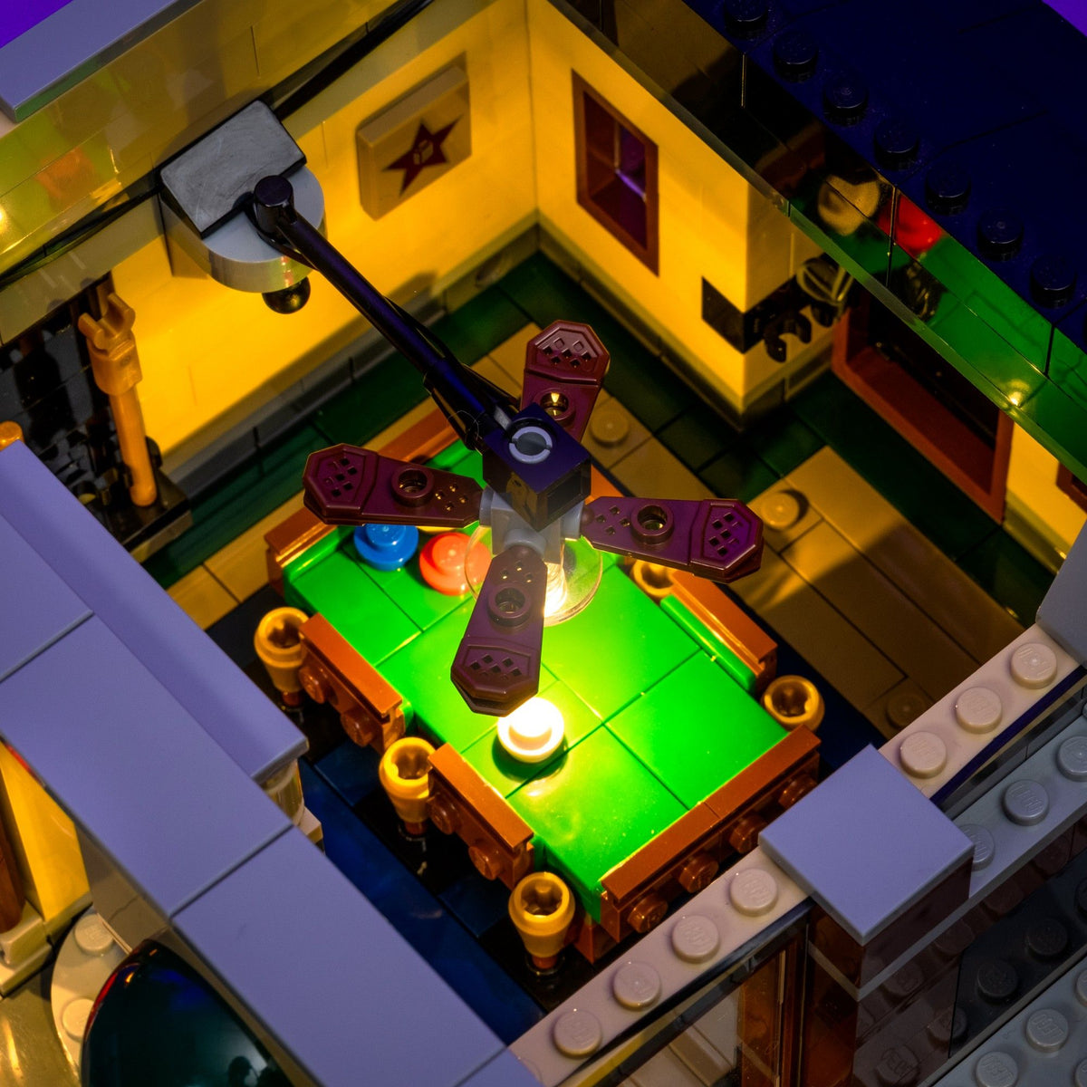 Warmly illuminated pool hall on a removable level of the LEGO® Detective’s Office