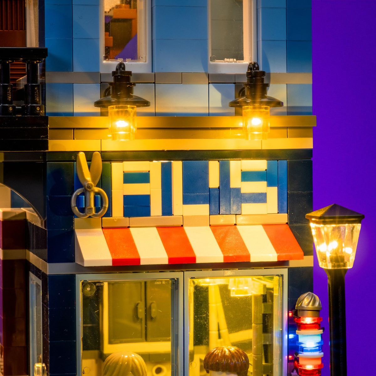 Warmly illuminated barbershop and street lamp on the LEGO® Detective’s Office