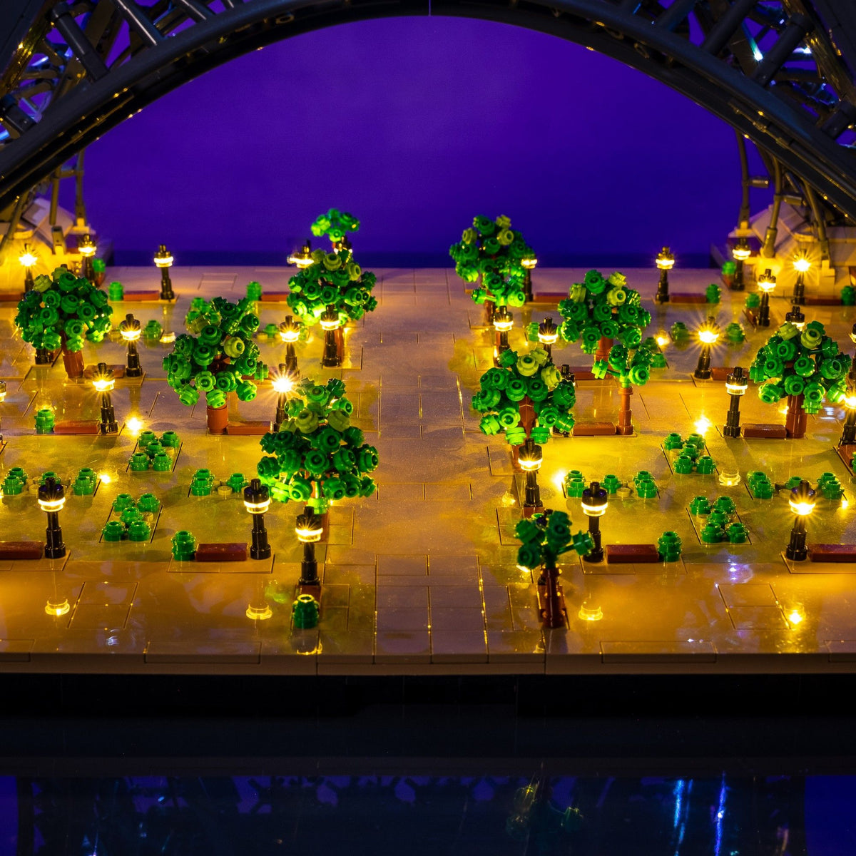 All 48 warm white illuminated park lamps beneath the LEGO® Icons Eiffel tower