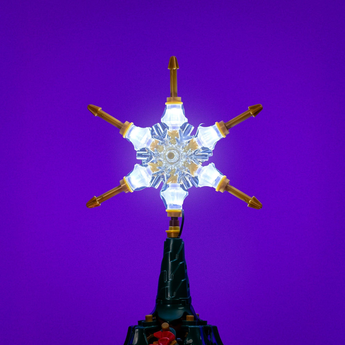 Brilliant illuminated star on top of the LEGO® Icons Family Christmas Tree