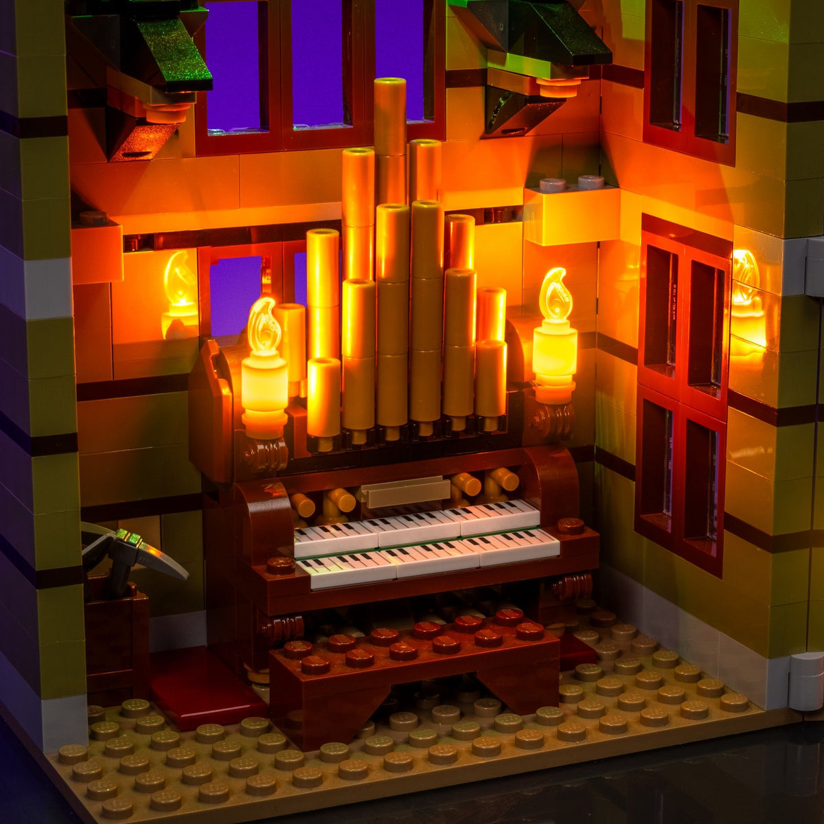 Flickering candles around the organ inside the LEGO® Icons Haunted House