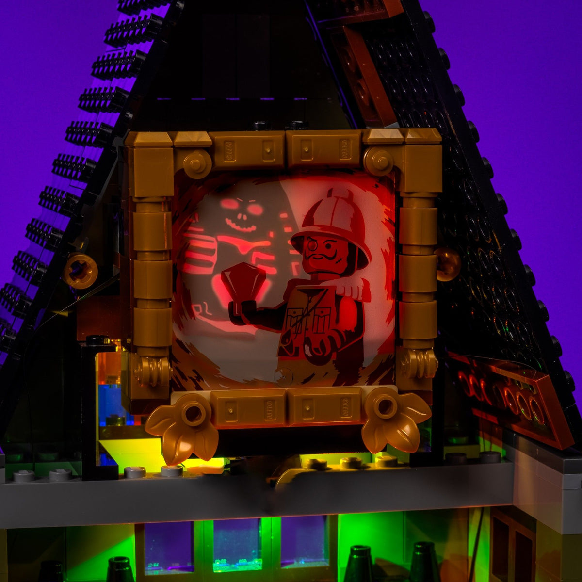 Cursed portrait flashing red inside the LEGO® Icons Haunted House