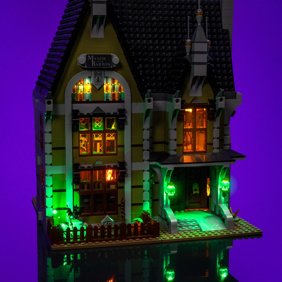 Eerie green illuminated entrance of the LEGO® Icons Haunted House
