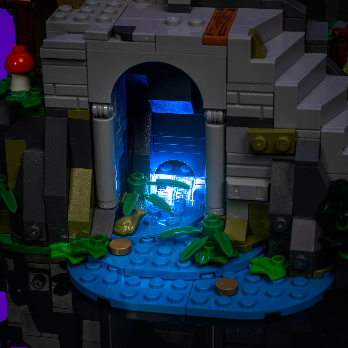 Blue illuminated water beneath the stairway of the Outlaw Forest Den