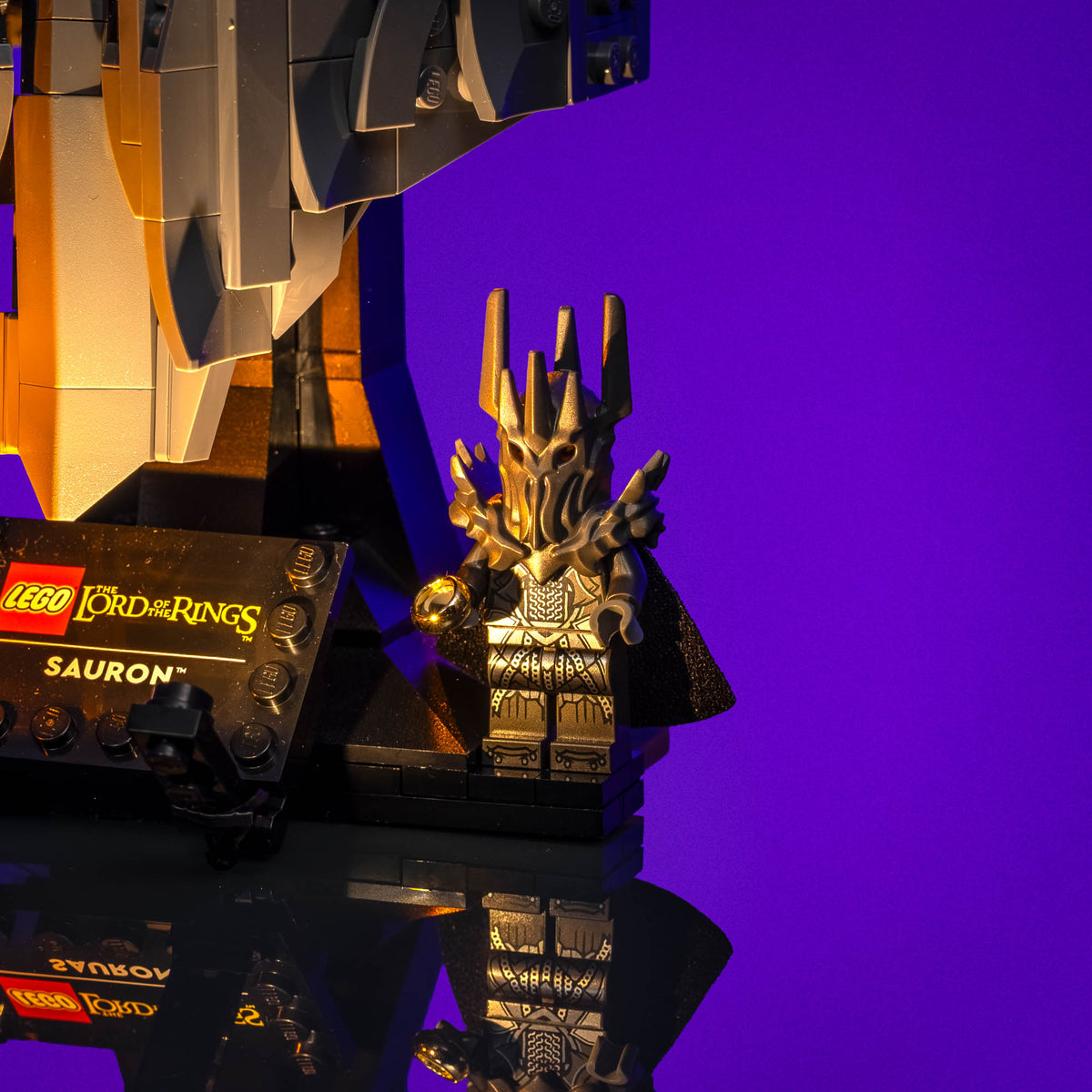 Sauron minifigure beside the fiery illuminated base