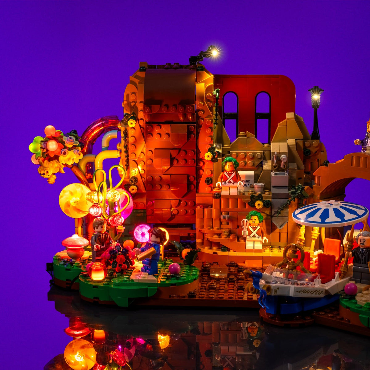 Cascade de chocolat chaleureusement éclairée dans le set LEGO® Ideas Willy Wonka